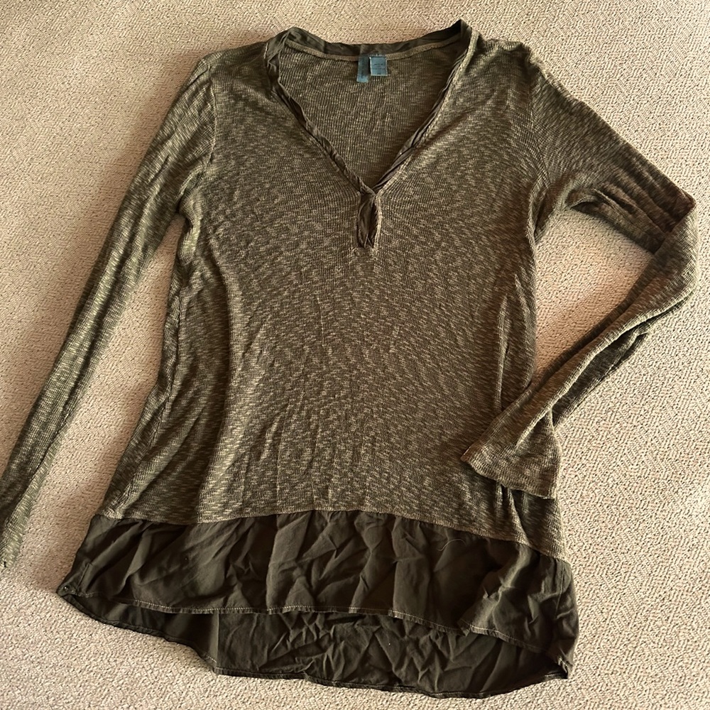 Green free people style sweater with peplum bottom.